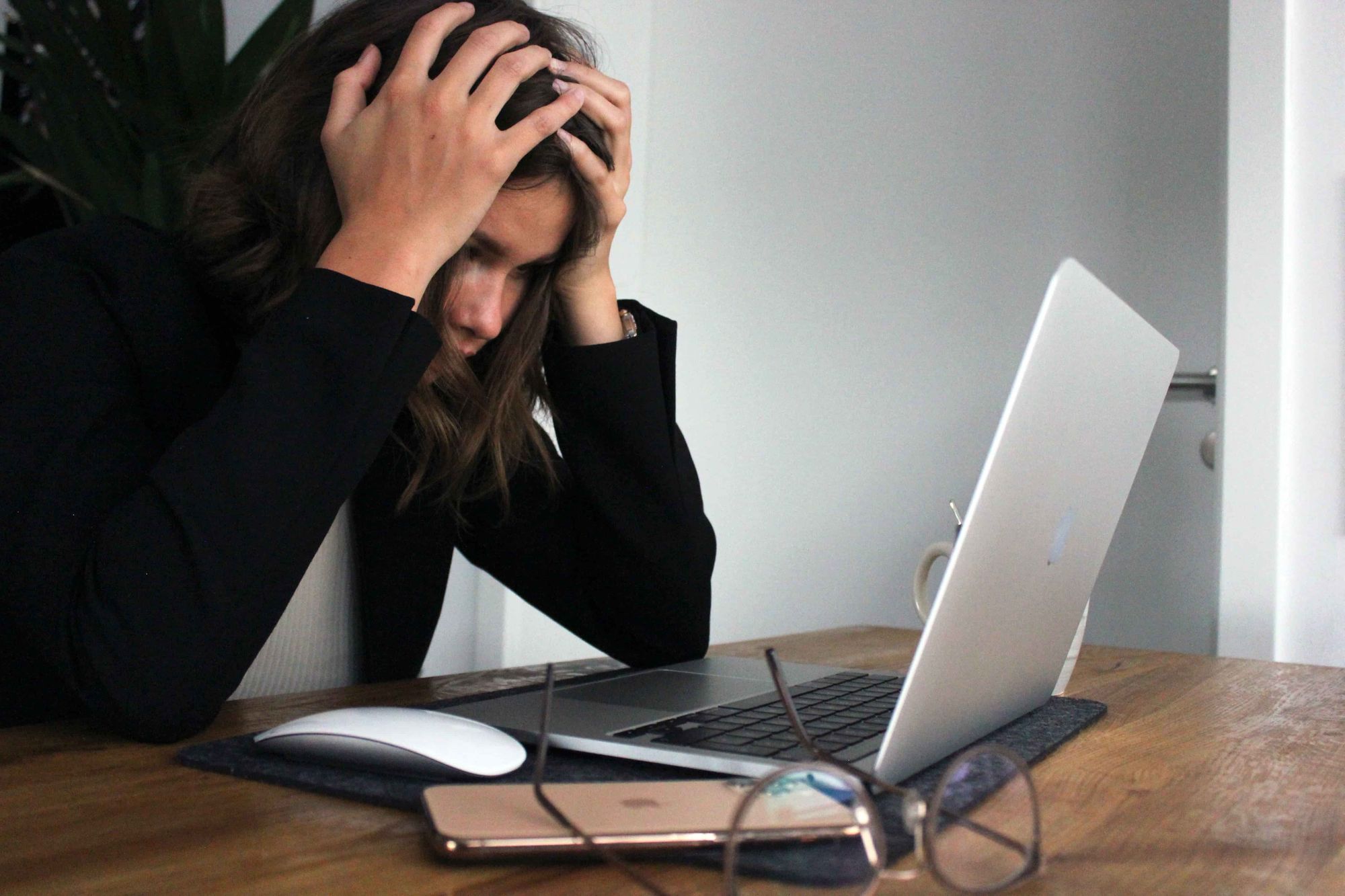 Woman looking at a computer with failed SCADA communication